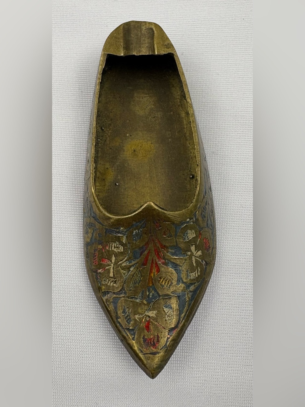Vintage etched brass slipper-shaped ashtray made in India.